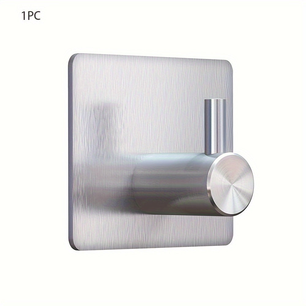 Contemporary self-adhesive stainless steel hook for towels, robes, coats, and other items in the bathroom or kitchen, with a waterproof design for easy shower wall mounting.