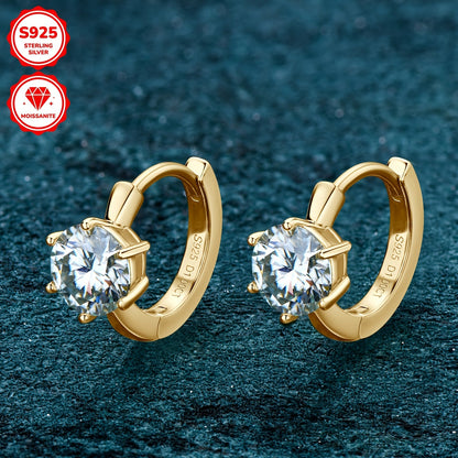 These elegant earrings feature a pair of round Mozambique stones, each 6.5mm in diameter and D color. The stones are set in a single six-prong setting with a 10mm inner diameter, crafted from 925 sterling silver. Accompanied by a GRA certificate, these