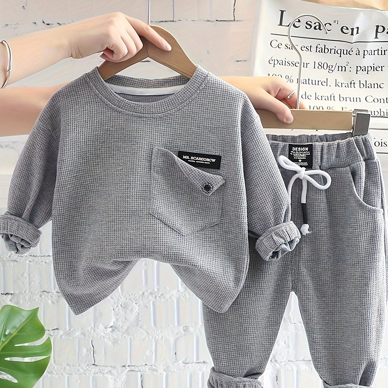 2-piece baby boy's street style set includes waffle textured long sleeve top and sporty casual pants for spring and fall outdoor wear.