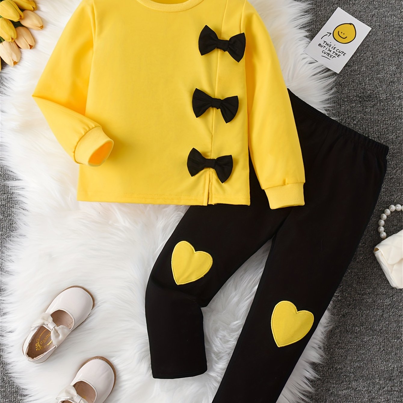 Girls' sweatshirt with bow decoration, long sleeves, and matching pants with love embroidery, ideal for outdoor activities.