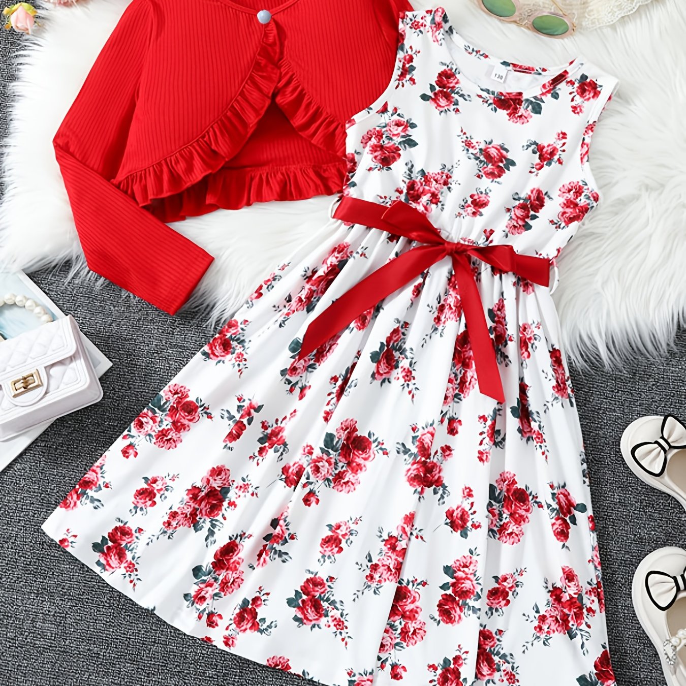 2-piece girls' spring/fall dress set with floral umbrella skirt and crew neck knit top. Made of 100% polyester, features long sleeve ruffle hem and button detail. Great for daily wear and