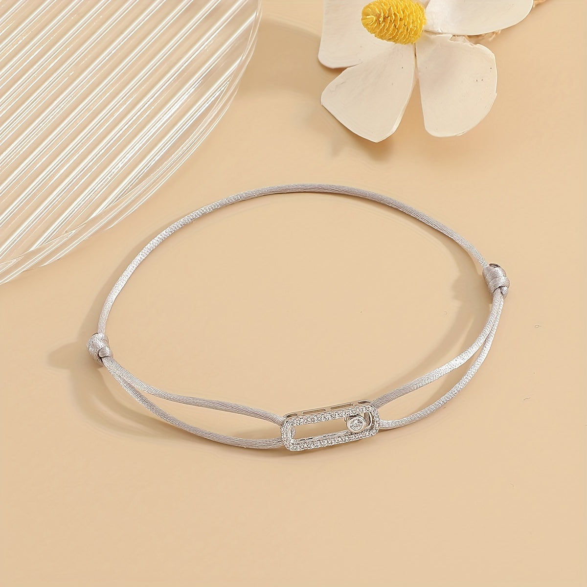 A stylish and timeless charm bracelet designed for women, featuring adjustable sizing and movable zirconia accents. This premium accessory is the perfect gift for any fashionable woman who appreciates high-quality jewelry.