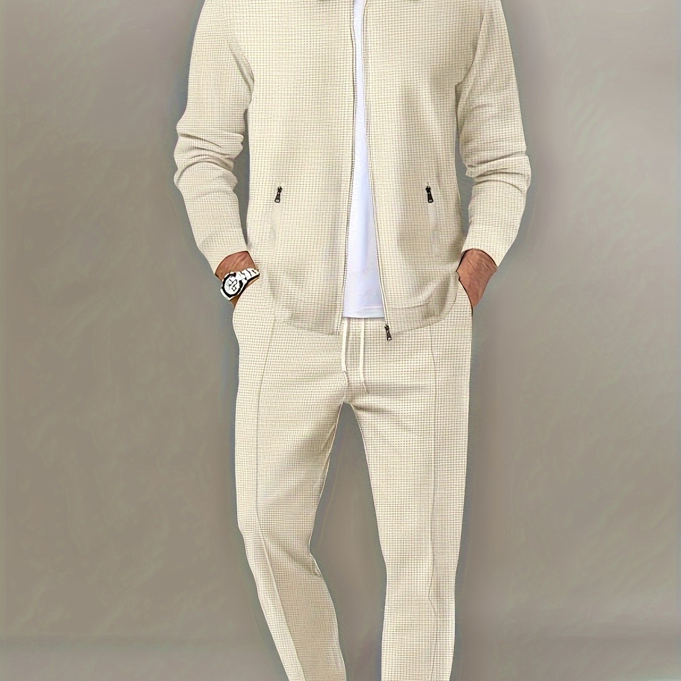 Men's beige waffle knit tracksuit set. Includes full-zip jacket and jogging pants. Made from polyester/spandex blend, machine washable. Perfect for gym and outdoor activities.