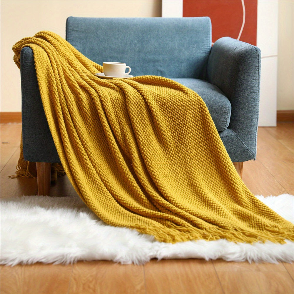 Stay cozy and stylish with this elegant knit throw blanket, featuring tassels for added flair. Made of lightweight acrylic with a bubble textured design, this blanket offers all-season comfort. Perfect for use on the couch, bed, or as home decor, as well