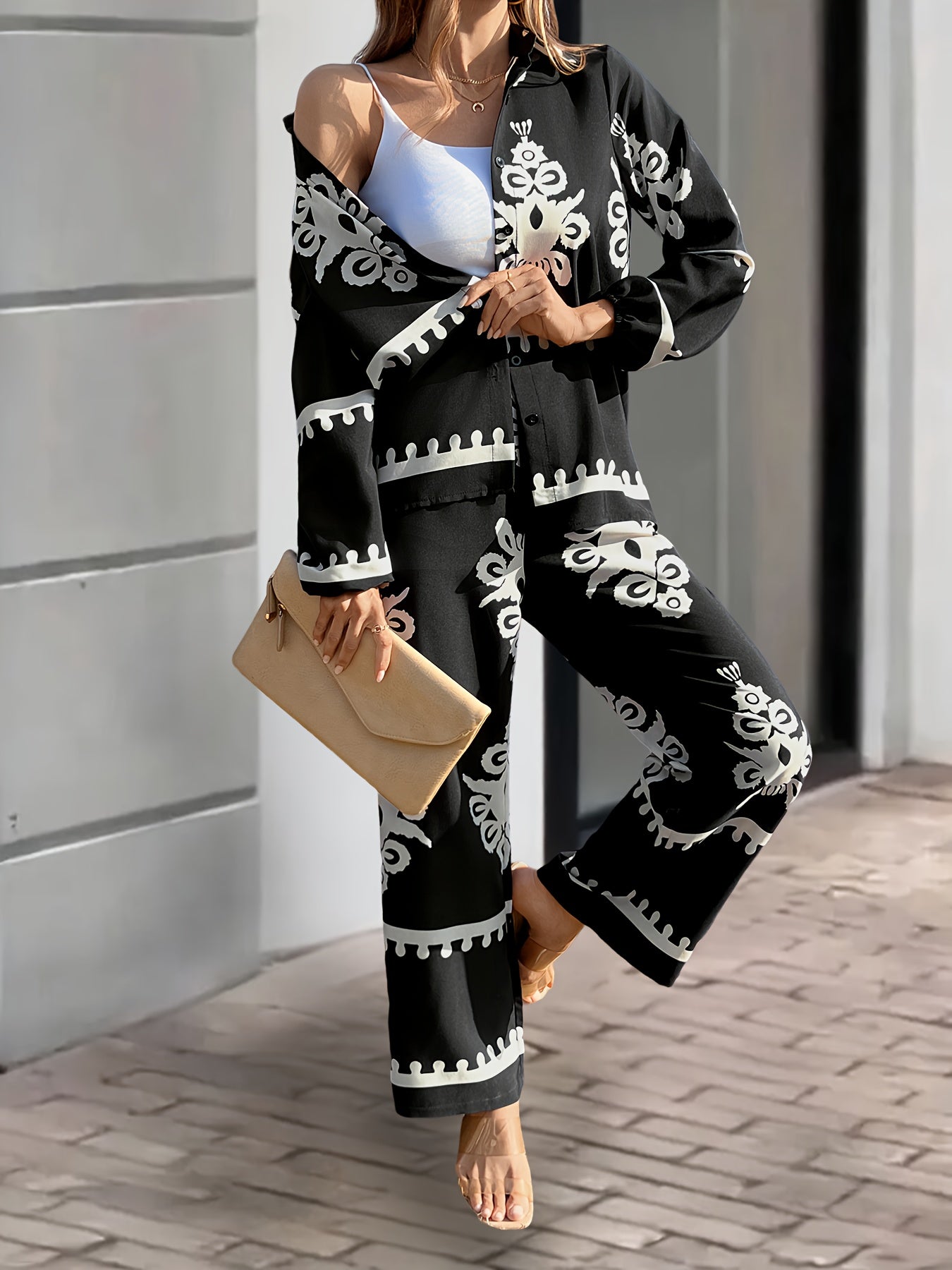 Women's 2-piece casual suit made of 100% polyester, featuring a long sleeve top with button front and pants with plant pattern. Loose fit with cardigan collar and regular sleeves, suitable