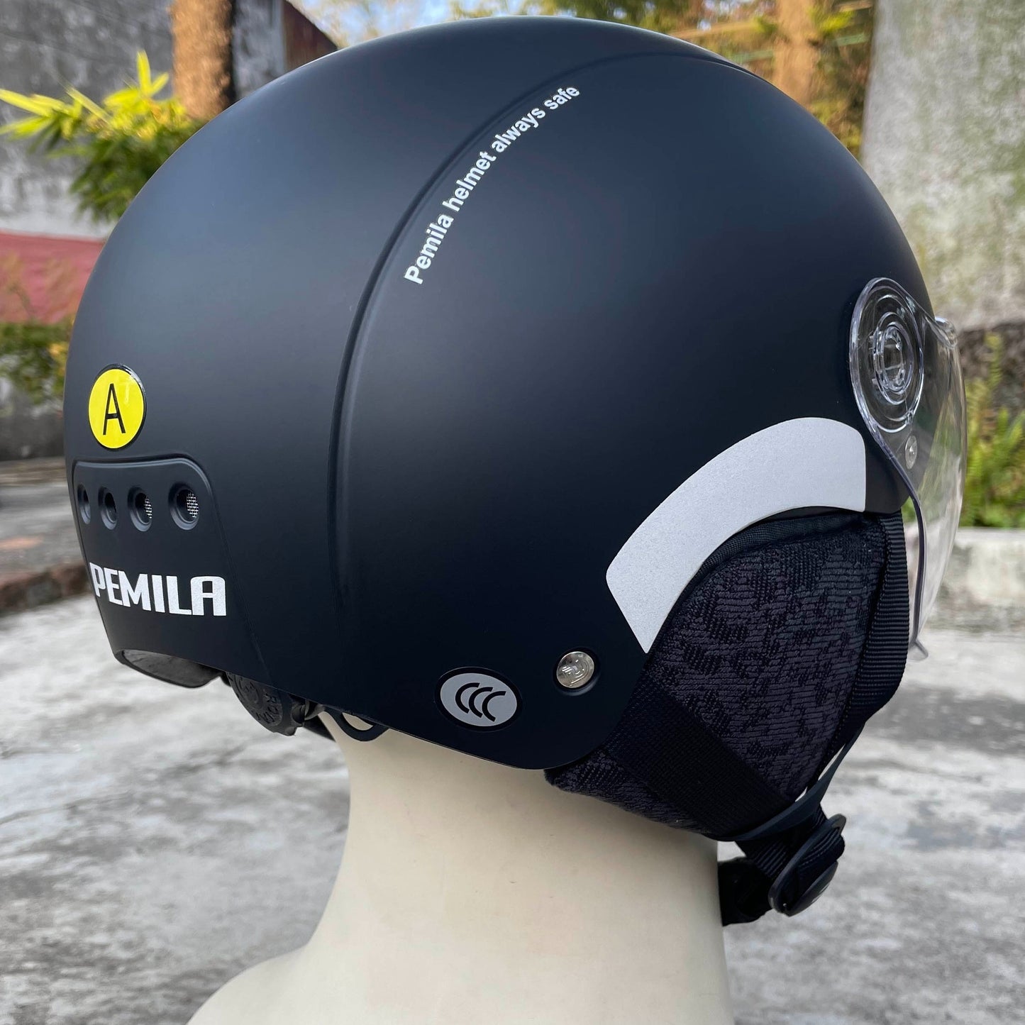 Pemila 2-in-1 cycling helmet with goggles, ear protection, adjustable fit 57-63cm, reflective strips for night riding safety. Made of ABS material in various color options. Includes