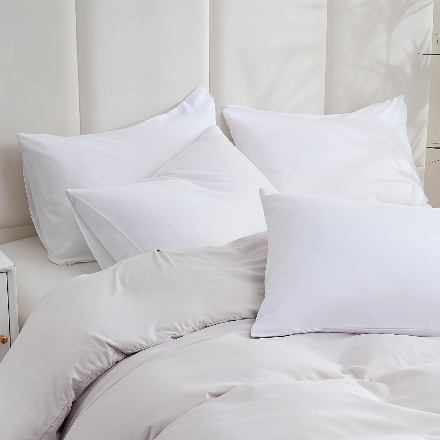 Get two sets of white pillowcases that are perfect for families, hotels, and apartments. These pillowcases provide a comfortable experience with their soft and breathable material. Made of high-quality fabric, they are suitable for bedroom, sofa, and