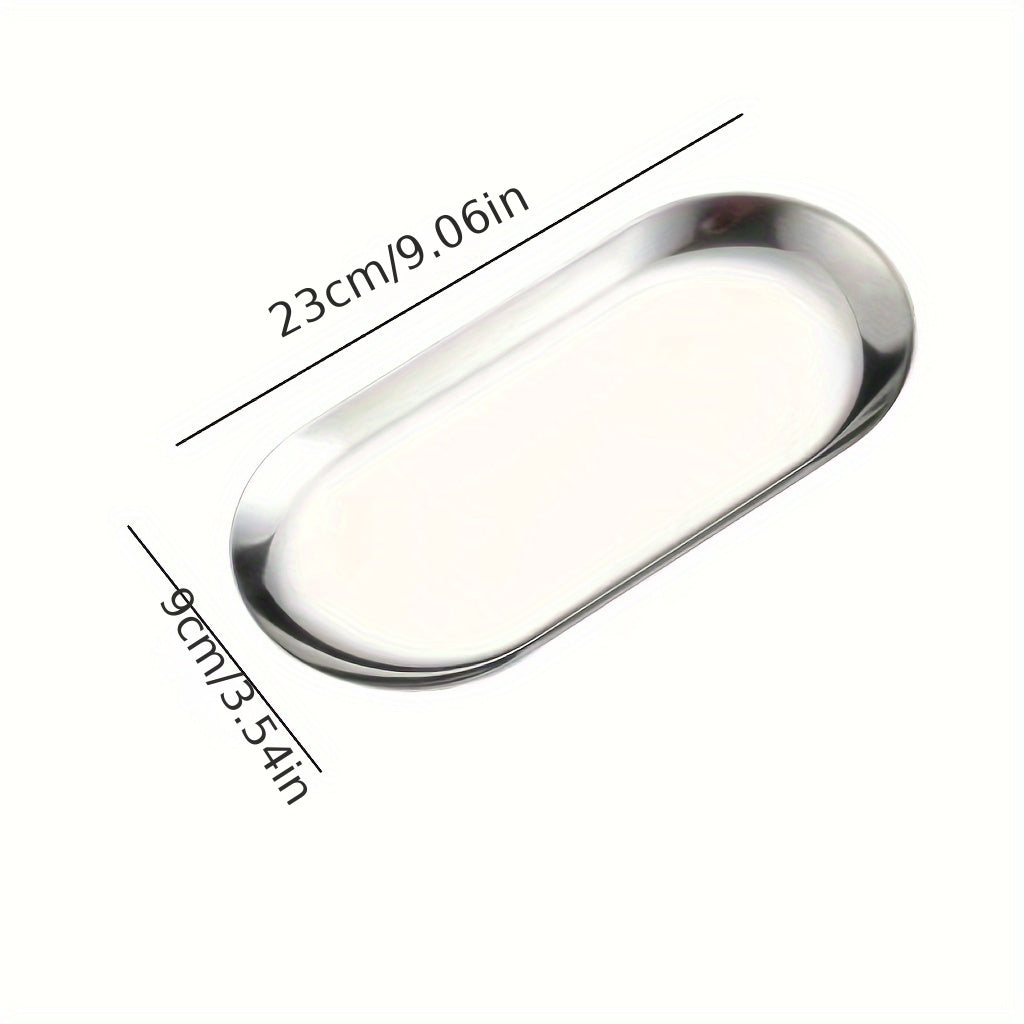 Stainless steel oval tray for jewelry, toiletries, or serving dim sum.