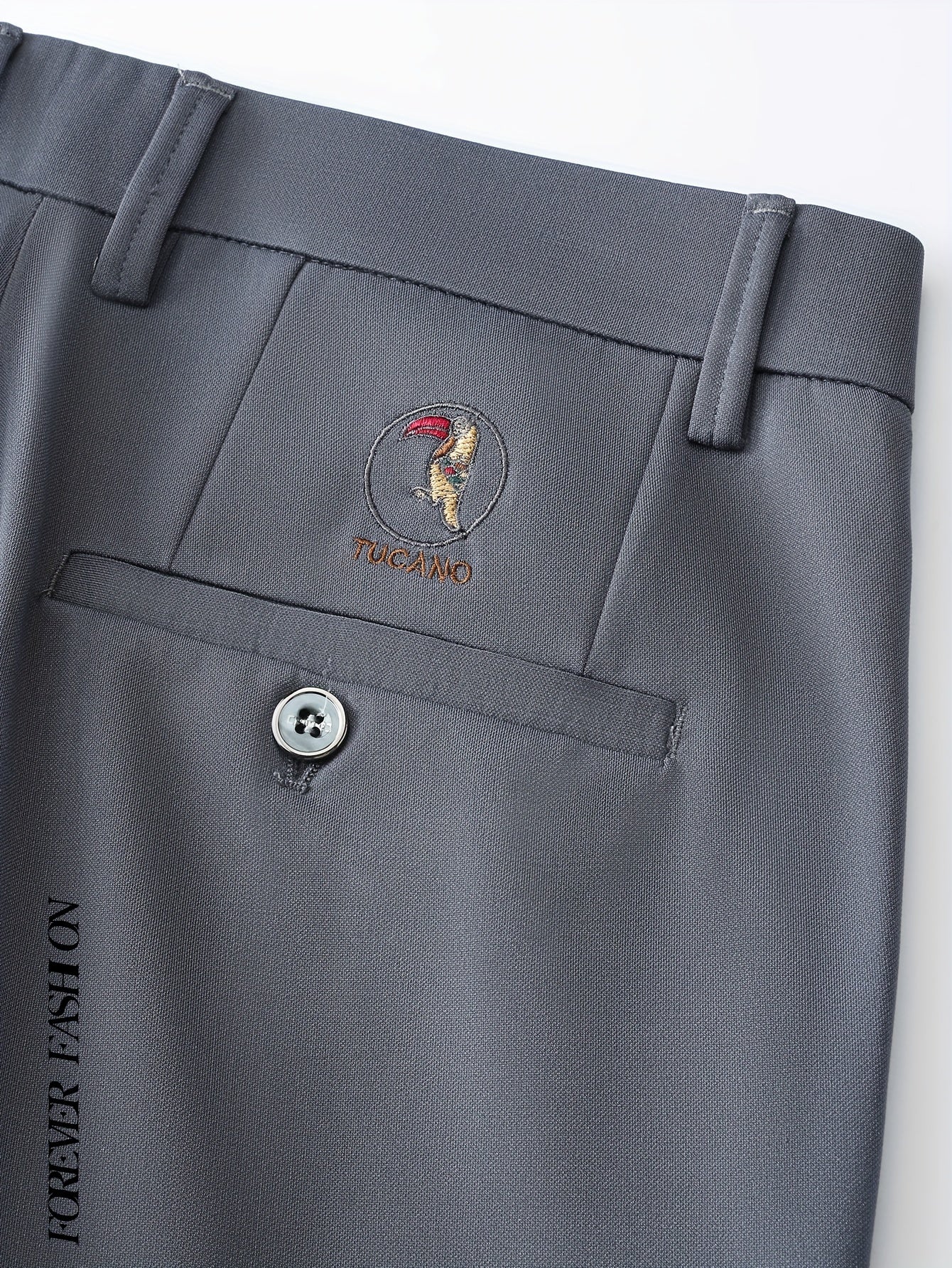 Stretchy black dress pants with bird emblem for men, slim fit, machine washable for business casual and social events.