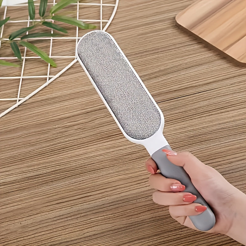 The versatile double-sided pet hair remover brush is perfect for removing pet hair from clothes, sofas, furniture, and bedding. It is reusable and features electrostatic technology for easy lint cleaning. Ideal for use in the living room, this brush