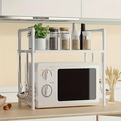 The Expandable Double-Layer Microwave Rack with Classic Style features 4 Hooks for added convenience. This Multi-functional Kitchen Storage Organizer is constructed with Metal and Plastic materials. Assembly is required, but no batteries are needed.