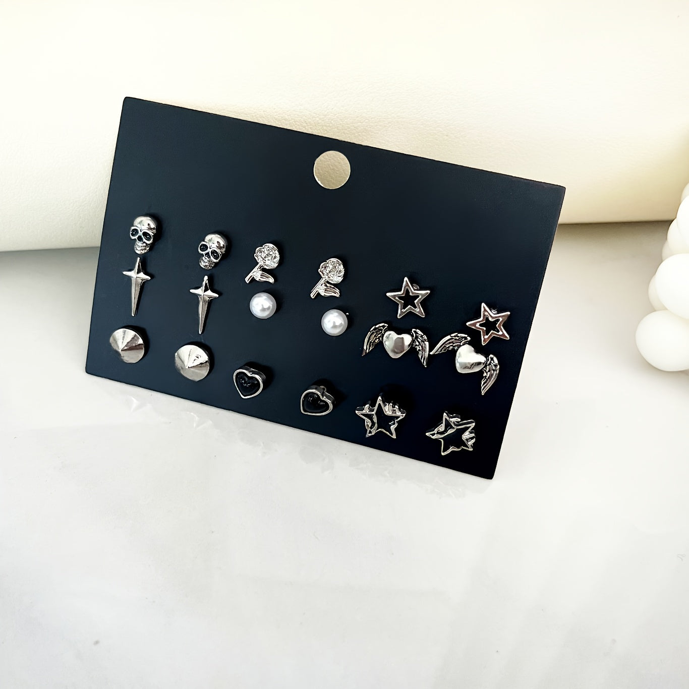 Vintage Gothic Earrings Set featuring 9 pairs, with designs inspired by skulls, roses, stars, hearts, and wings made from zinc alloy. Perfect for daily wear or parties, these earrings are a high aesthetic addition to any outfit. Makes a great Valentine's