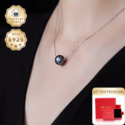 This necklace features a stunning large grain round Tahitian black pearl pendant suspended on a S925 silver chain. Each pearl is unique, so the color and shape may vary. This simple yet elegant piece is perfect for any woman's fashion collection and