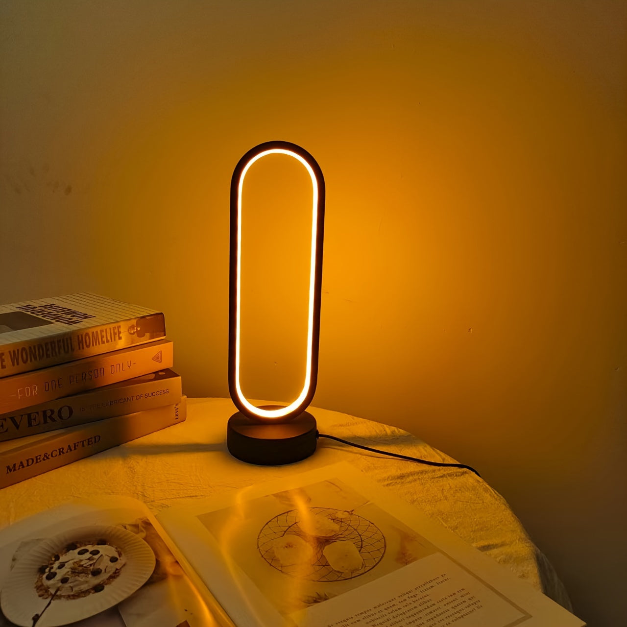 USB-powered LED ring table lamp in black or white; dimmable for bedroom and living room decor.