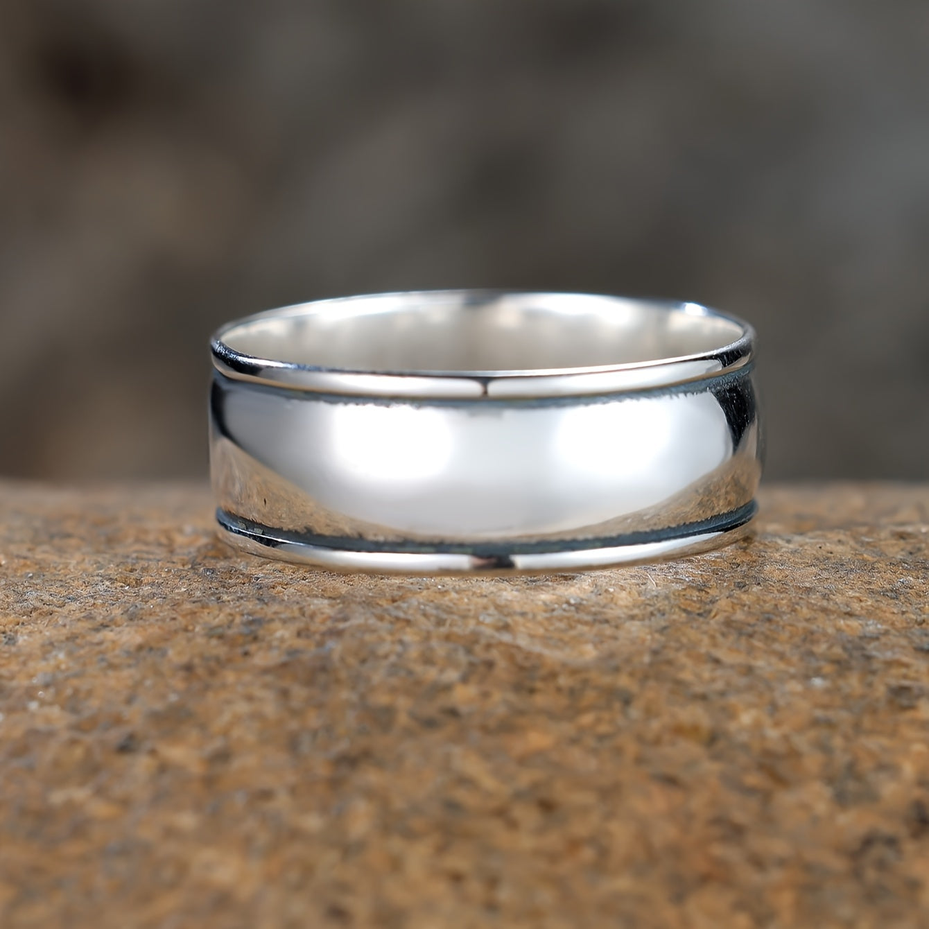 This trendy wide band ring is made of 925 sterling silver and features a polished surface in a trendy wheel shape. It is suitable for both men and women and can easily match your daily outfits. Weighing 3.9 grams, this stylish ring is a versatile