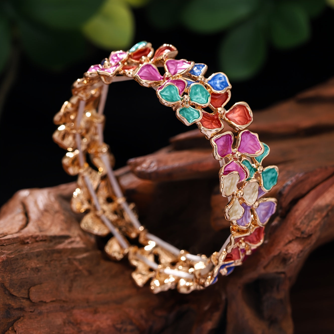 Elegant and timeless, this colorful enamel flower bracelet is made of high-quality zinc alloy. It is designed for women and features a fashionable stretch bangle style that is 18K golden plated. Perfect for daily wear, parties, and holidays, this