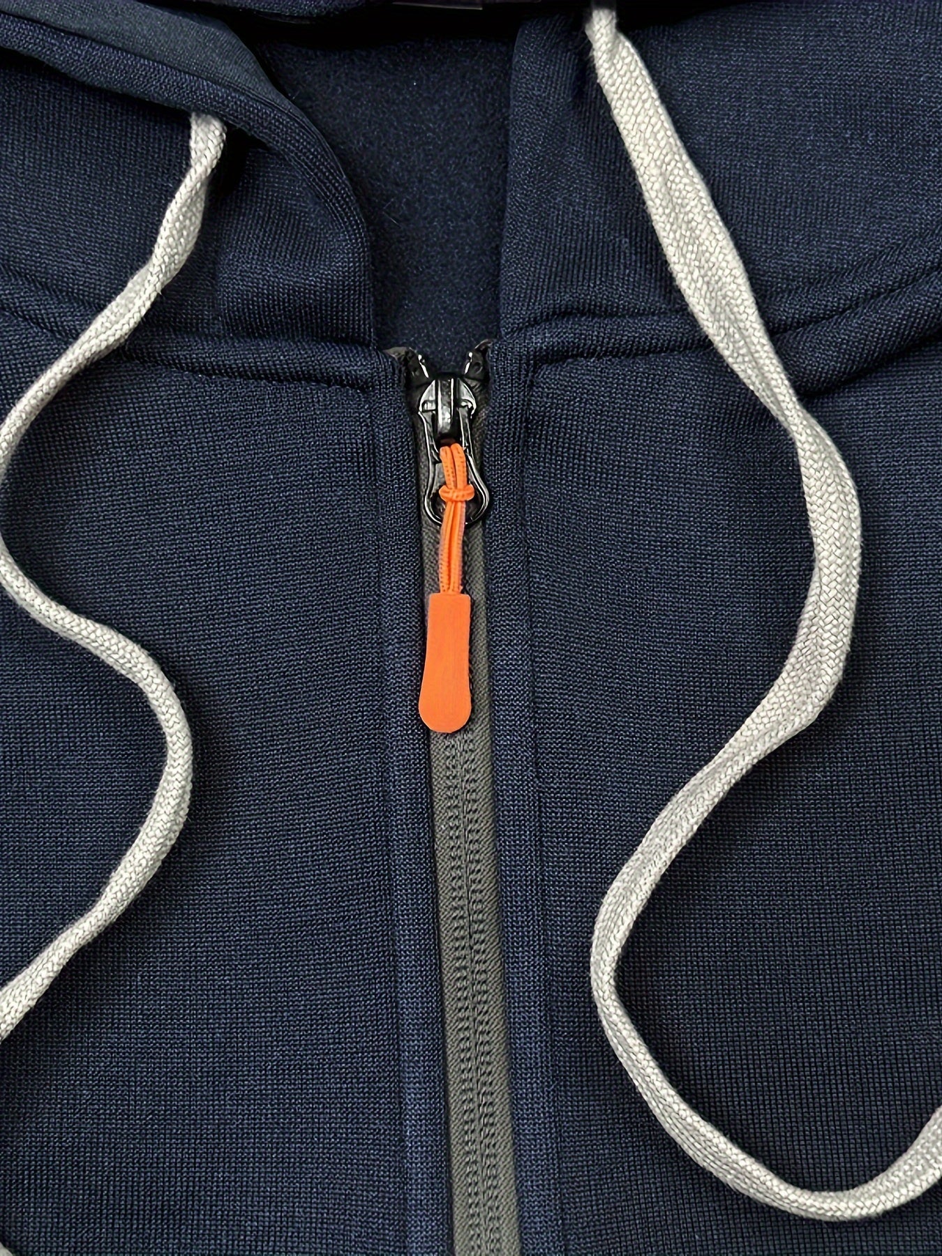 Men's navy blue fleece-lined hoodie with multiple zipper pockets, V-neck, and sporty pullover design for fall and winter.