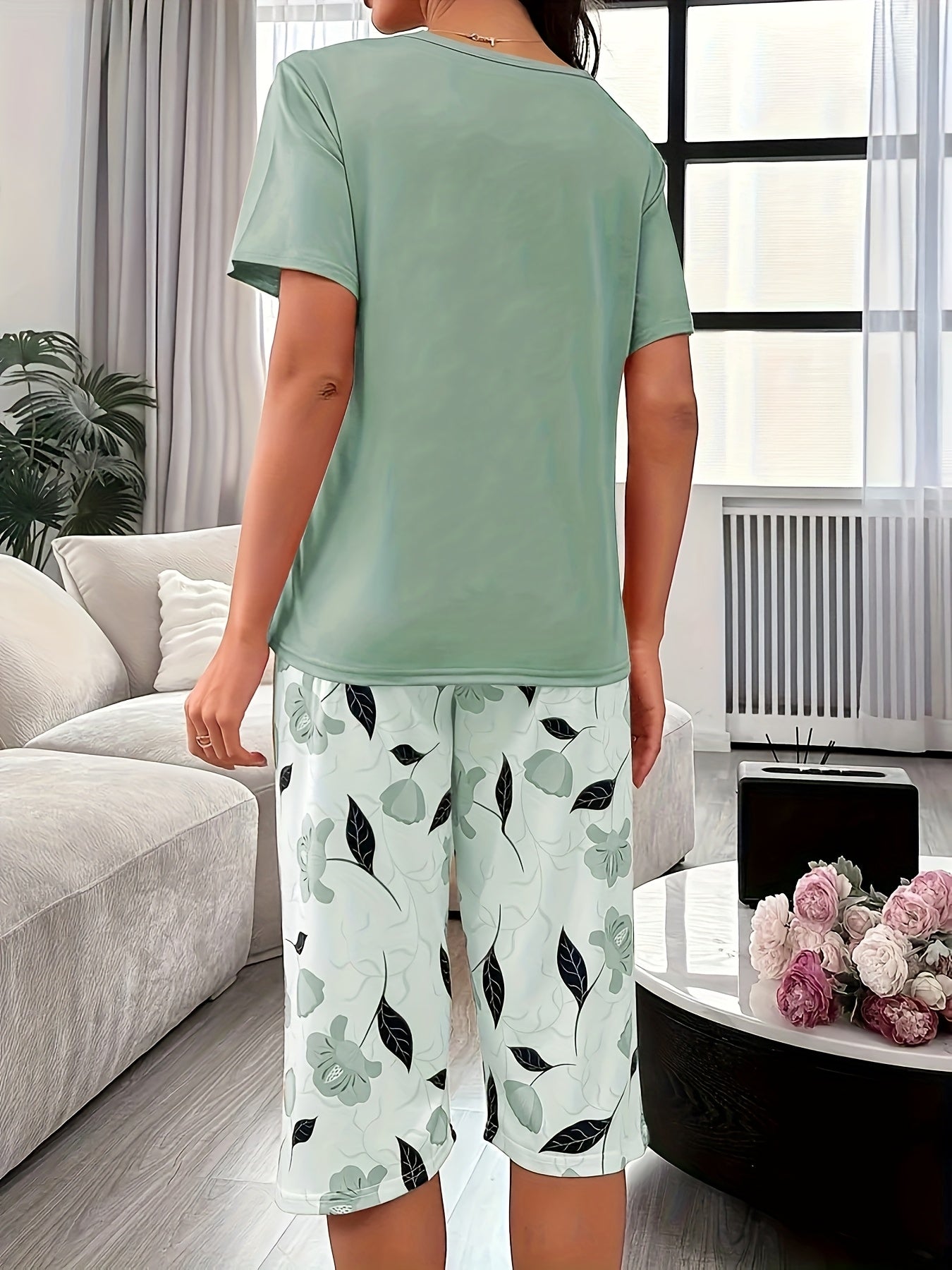 Trendy floral print three-quarter pants set for outdoor wear and loungewear for plus size women.