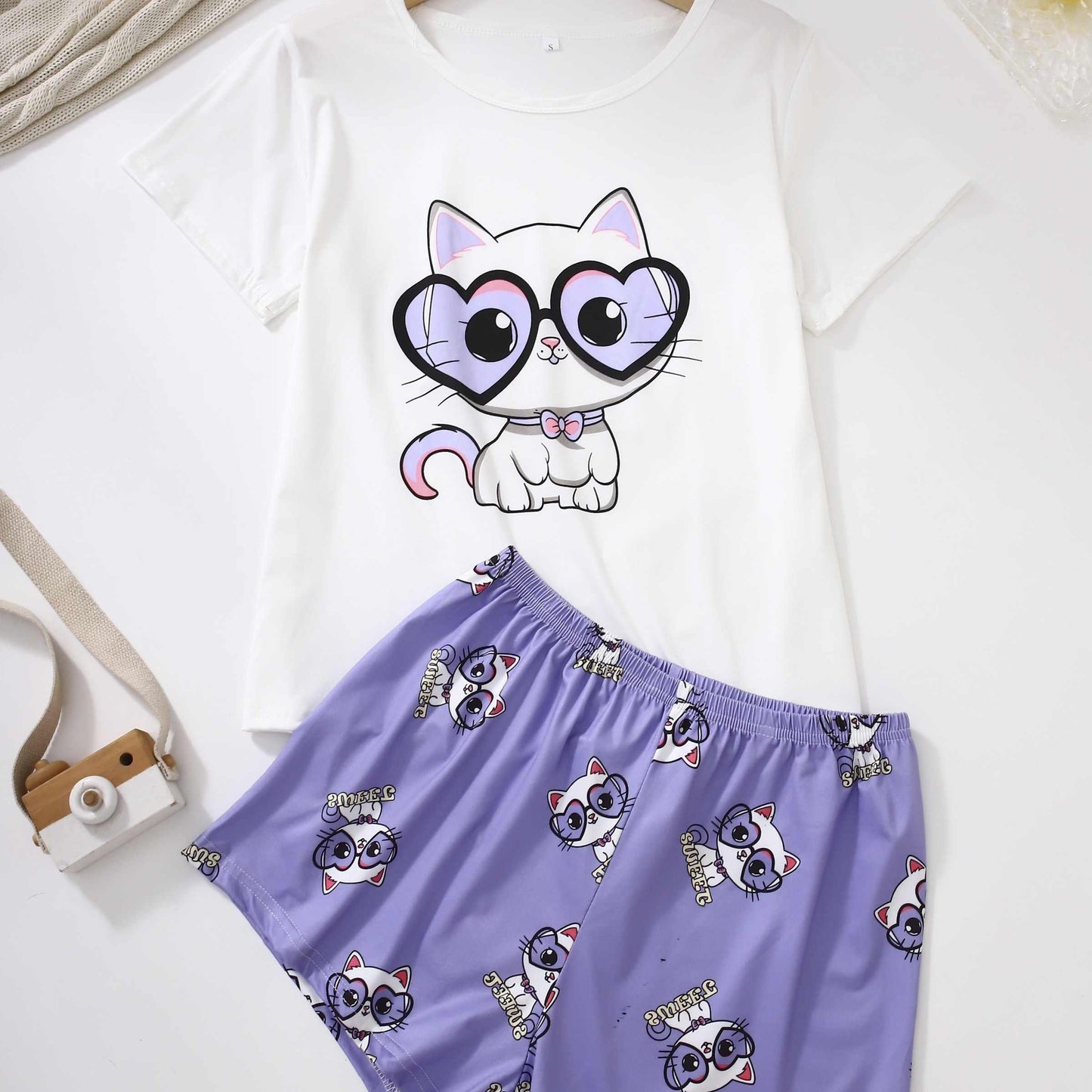 Cute cat print lounge set for women, includes short sleeve top and shorts for comfortable fit.