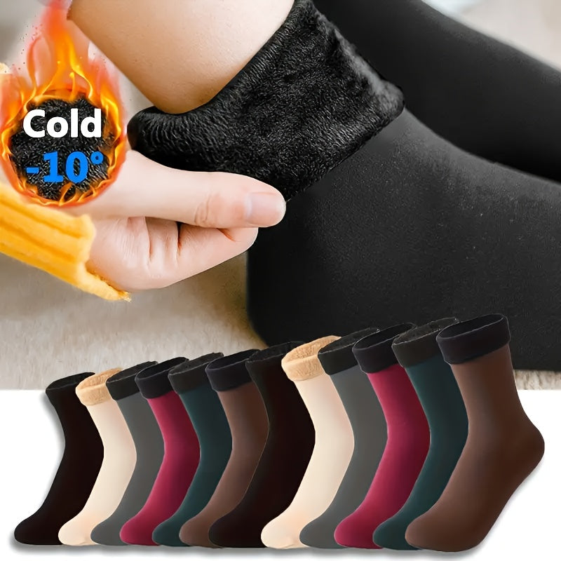 5 pairs of women's crew socks made of soft fuzzy polyester blend, perfect for cold weather. Machine washable.