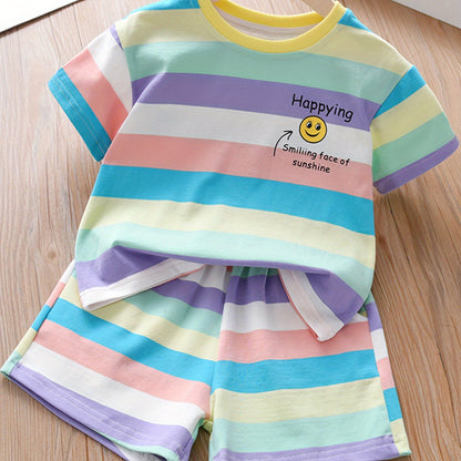 Summer fashion set for girls: Cute T-shirt with joyful face & letter print paired with striped shorts. Made of cotton blend, machine washable, ideal for outdoor activities.