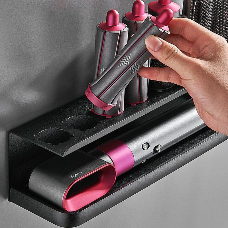 Wall-mounted metal organizer for hair dryer and curler, saving space in the bathroom.