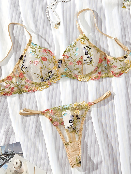 Romantic semi-sheer lingerie set with floral embroidery.