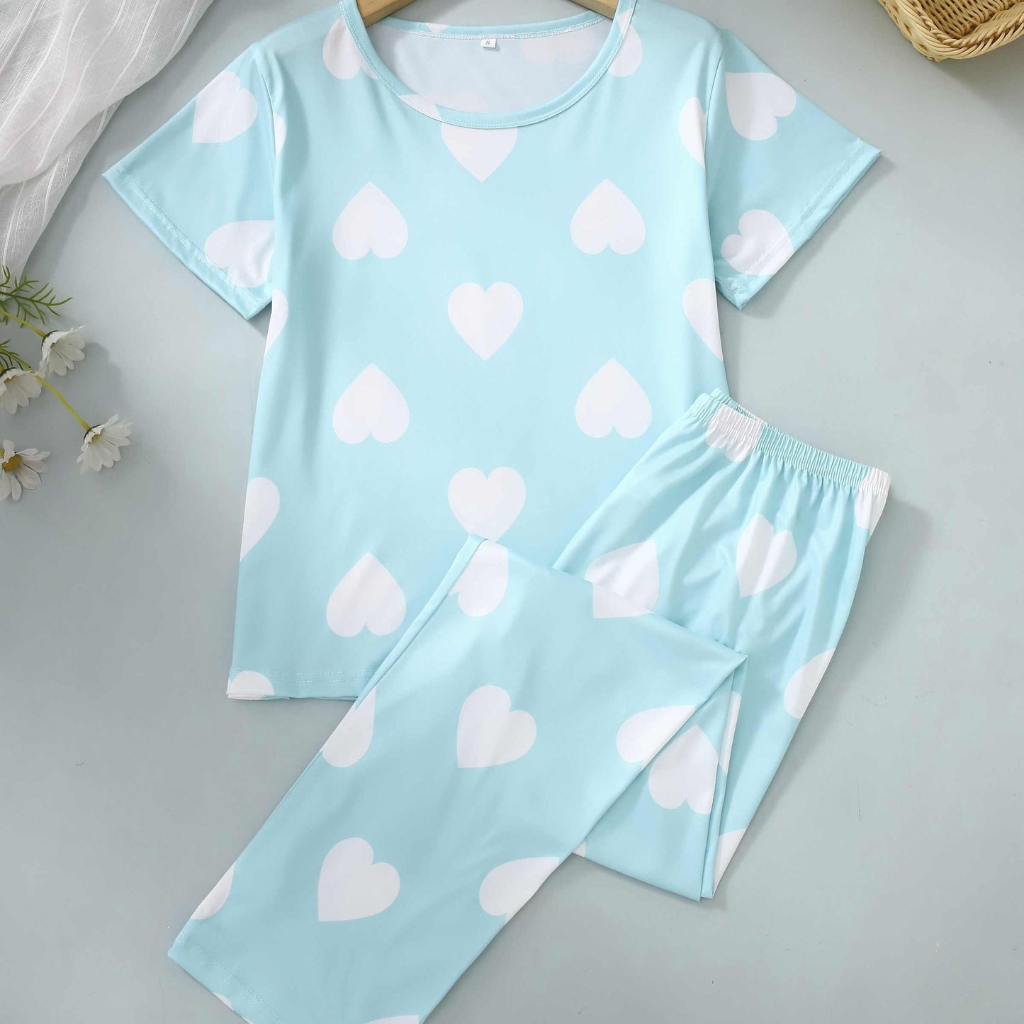 Two-piece pajama set with short-sleeved top and long pants in print.