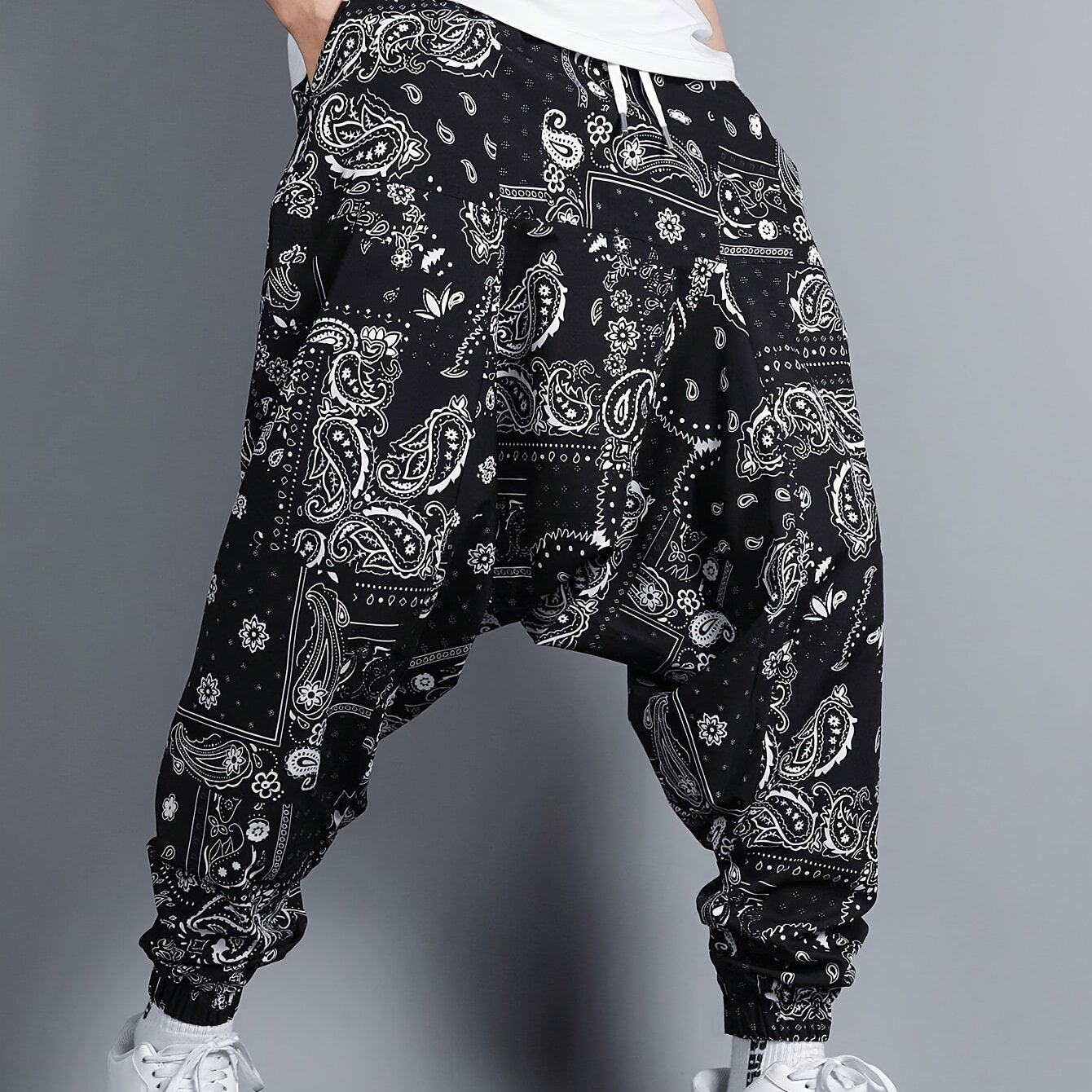 Men's oversized joggers featuring paisley pattern print.