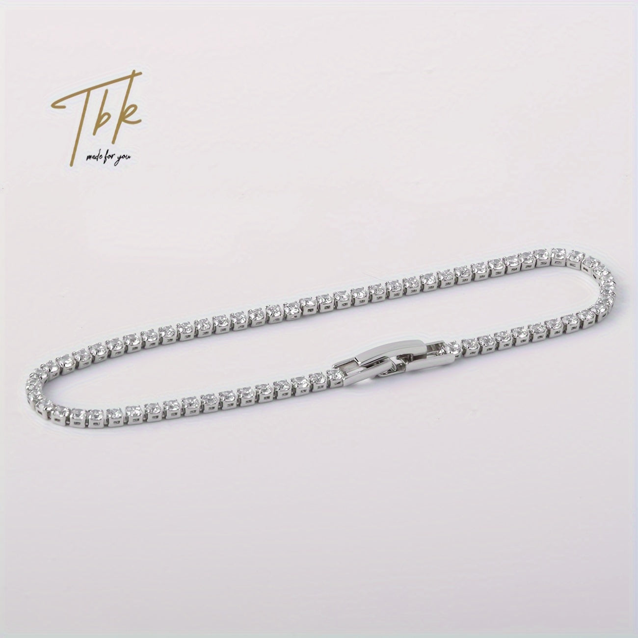 Ice up with this dazzling zirconium-studded tennis bracelet made of shiny titanium steel, presented in a gift box for an extra touch of luxury.