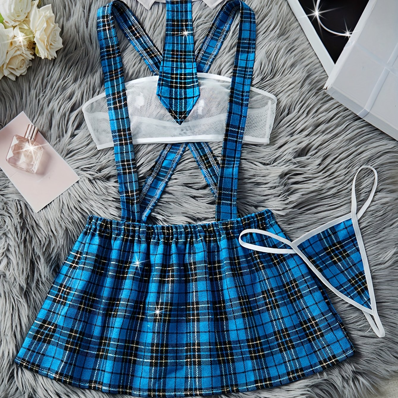 Color block plaid role-playing costume set includes strapless bra, suspender skirt, thong, and tie. Perfect for women's exotic clothing and sexy lingerie.