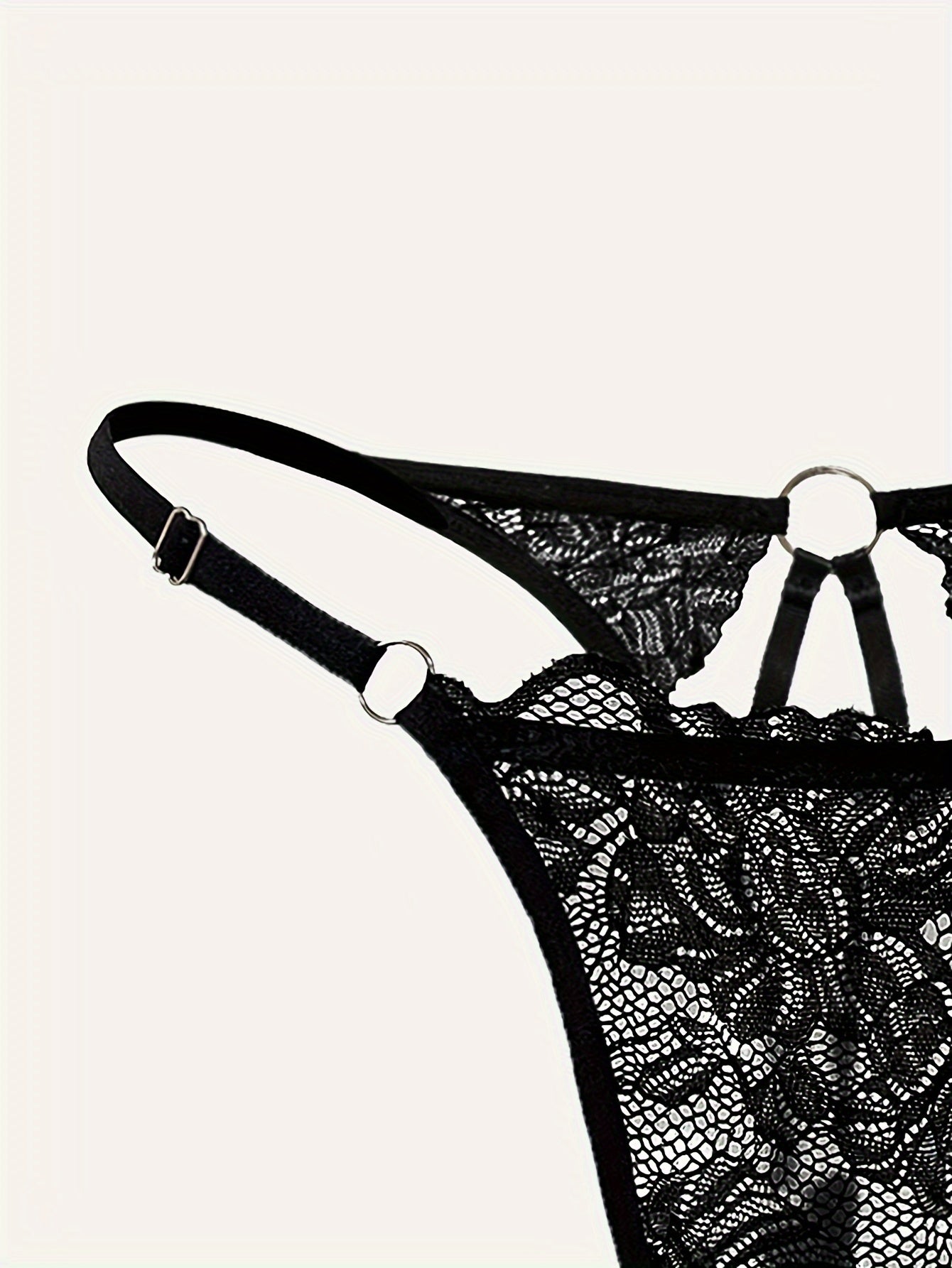 Lace thong with metal ring and see-through design