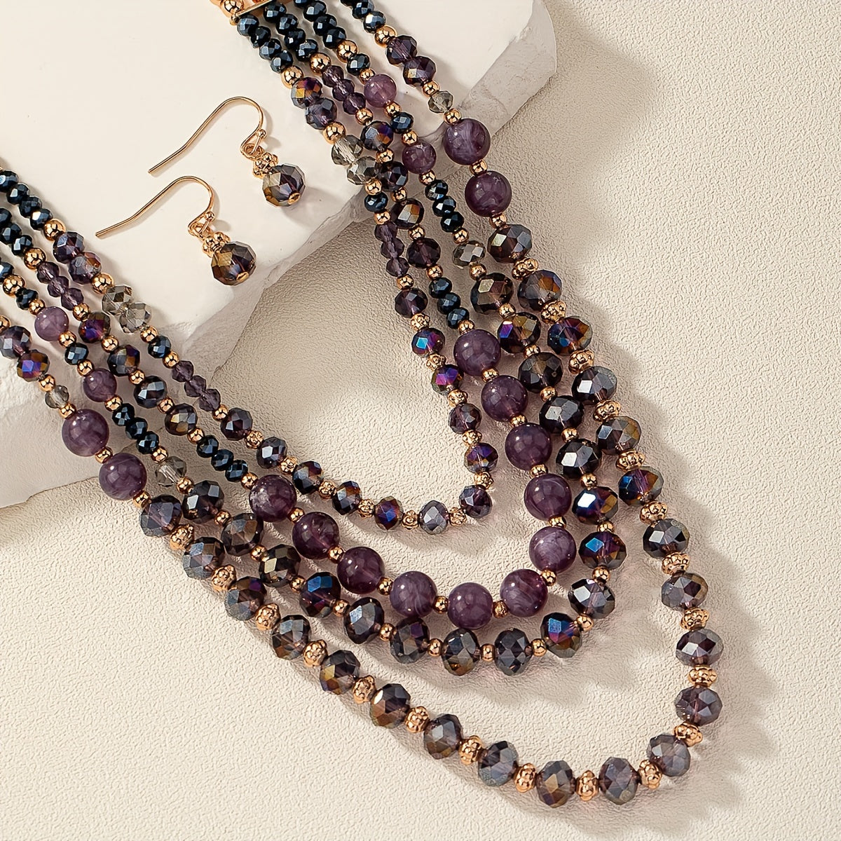 Luxurious and elegant, this Purple Series Beaded Necklace Set exudes style and sophistication. Featuring multiple layers, it is perfect for stacking and adds a touch of glamour to any woman's jewelry collection.