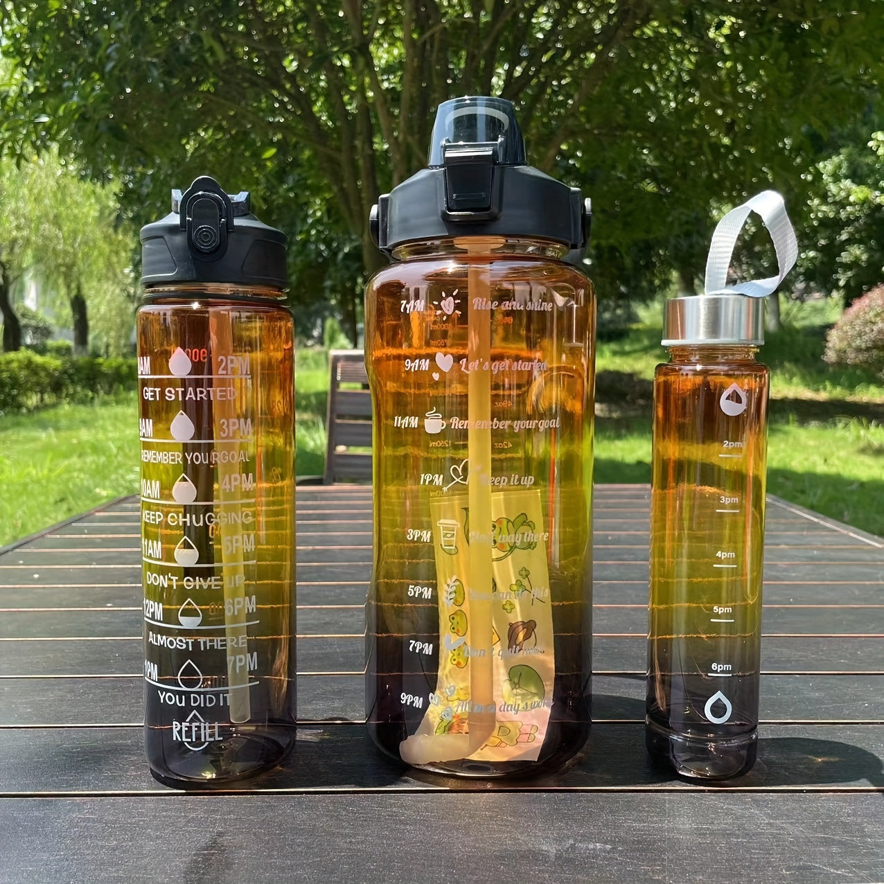 Set of 3 gradient color motivational water bottles (64oz, 32oz, 15oz) with mobile phone holder, food grade material straw cup, 2 stickers. Perfect for home and outdoor use, ideal Christmas gift.