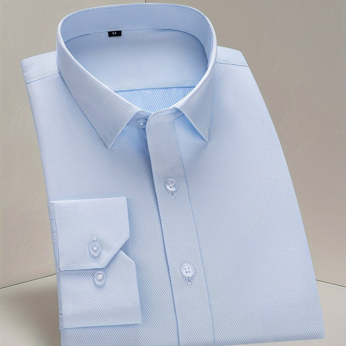 Men's classic long sleeve button up dress shirt in solid color, perfect for business and formal events.