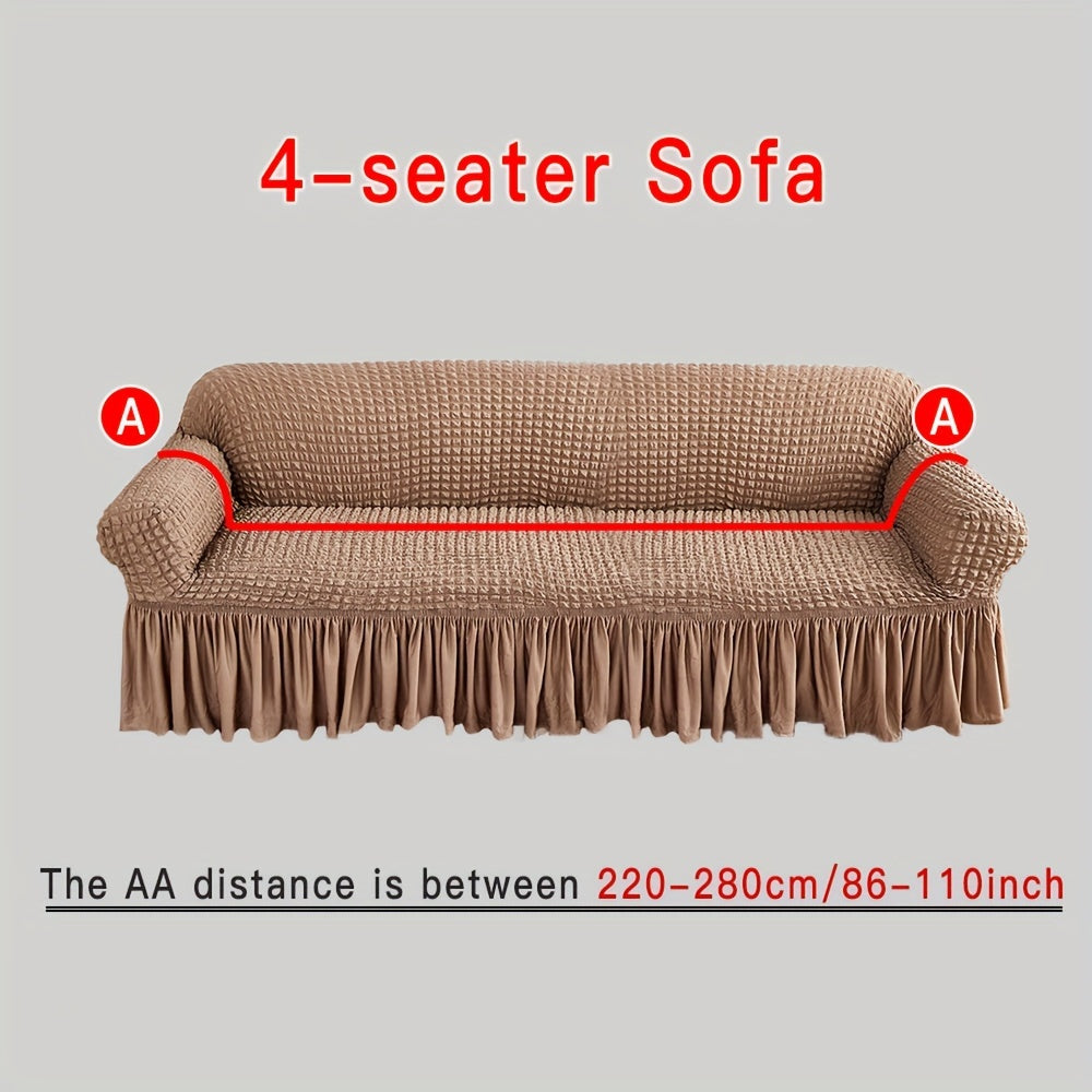 Stylish beige sofa cover with elastic skirt. Fits all sofa sizes and is machine washable. Perfect for any room decor. Great for living room sofas.