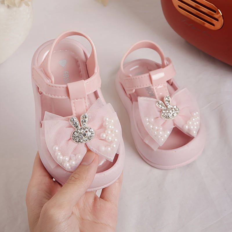 New 2024 baby girl sandals with anti-kick feature, cute rabbit design, and soft soles for beach.