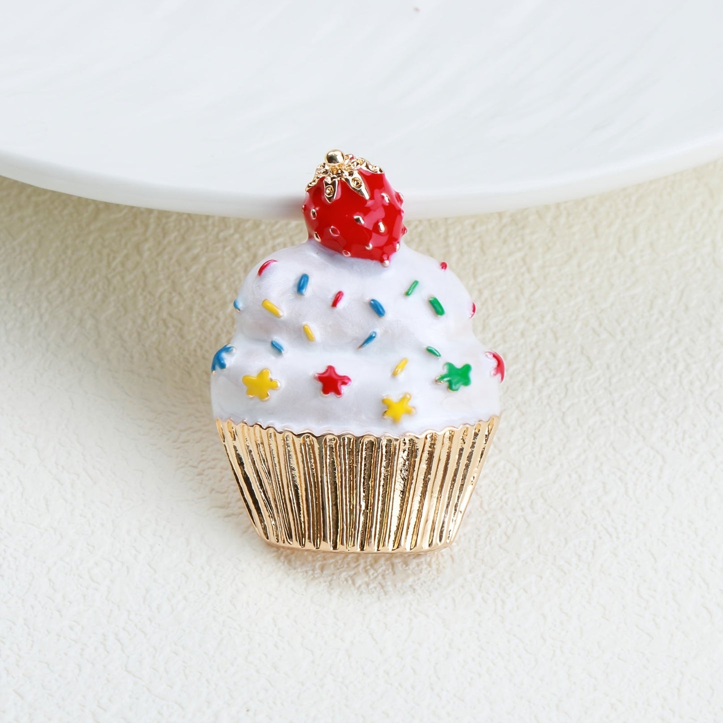 Add some festive flair to your holiday outfits with this adorable Cute Christmas Cupcake Brooch Pin. Crafted from enamel, this accessory is the perfect way to spread holiday cheer wherever you go.