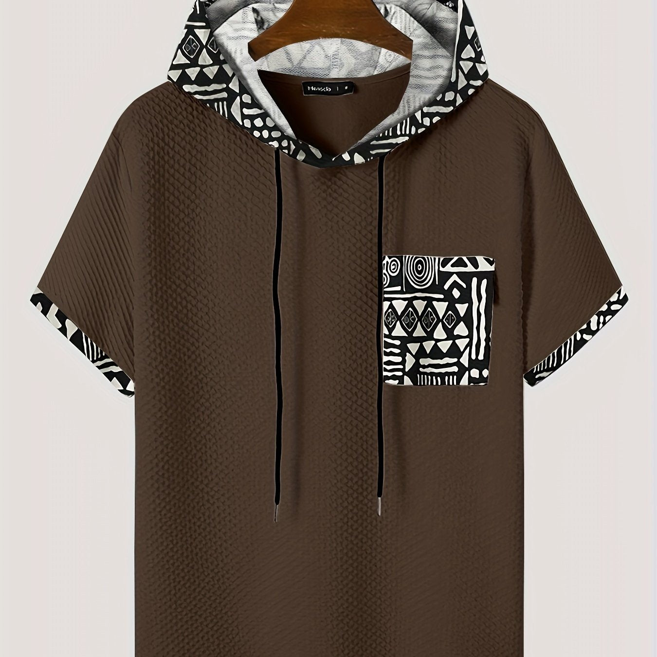 Men's plus size casual hooded t-shirt with geometric print, made from lightweight polyester fabric in gray with black and white patterns. Includes drawstring hood for comfortable fit and