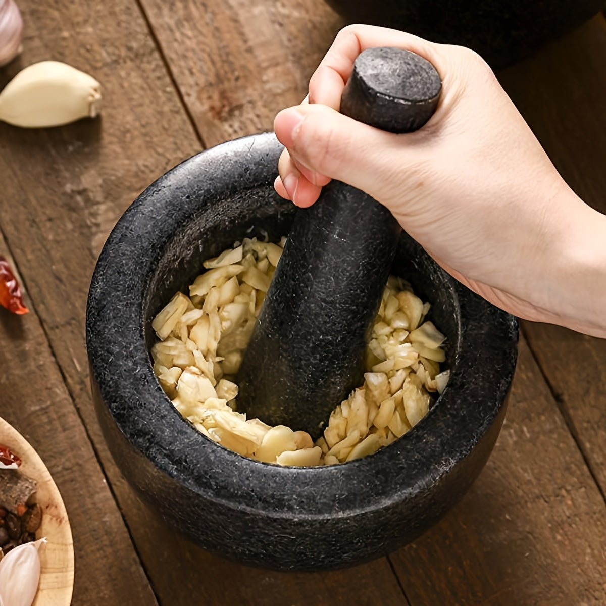 One piece of natural stone bowl designed for use in kitchens. This polished molcajete is perfect for grinding garlic, spices, and herbs. It can also be used as a traditional garlic crusher, grain and seed mill.