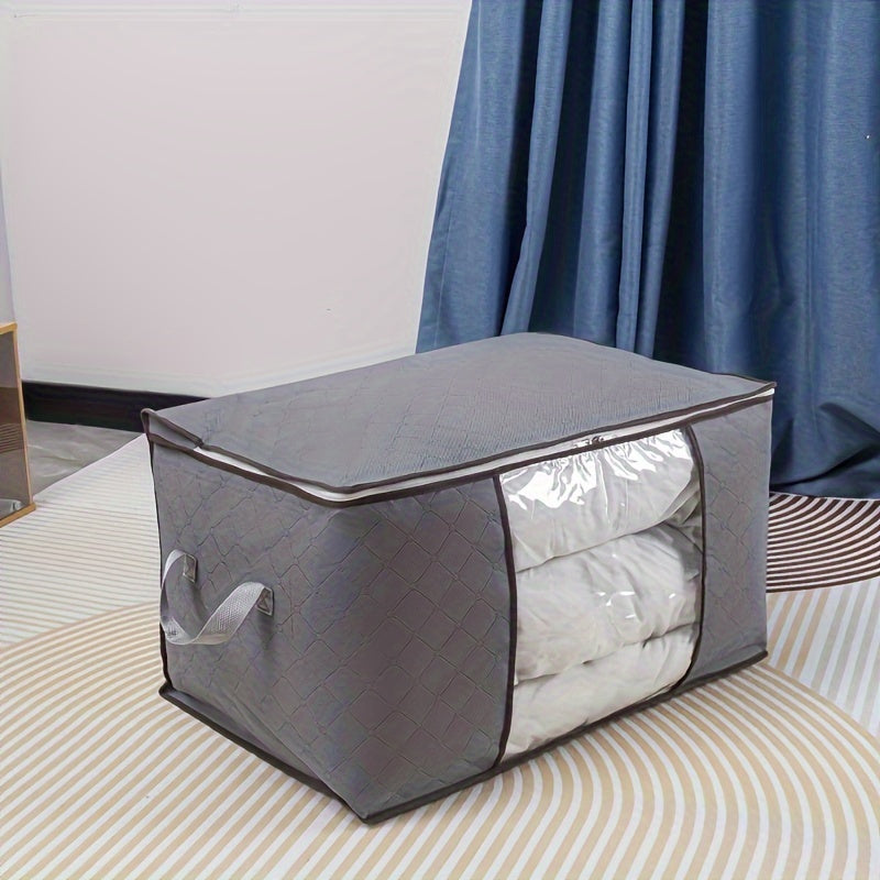 Big fabric bag with clear window for storing clothes and blankets.