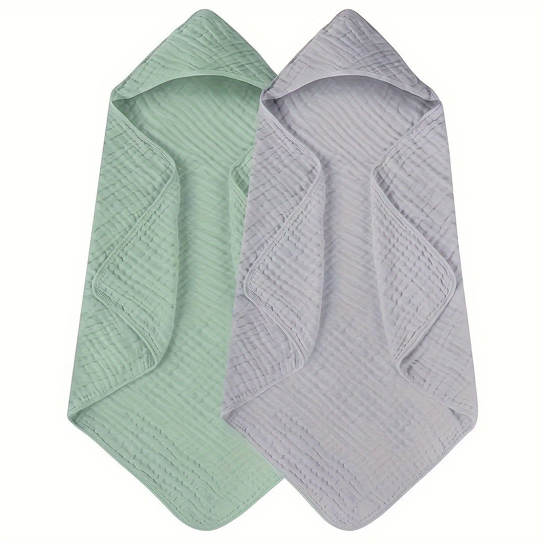 Two-pack of Bindi Monkey hooded baby towels made from 100% cotton for superior absorbency. These towels feature a cozy hood, perfect for infants and toddlers aged 0-3 years. Soft and comfortable, they can also be used as a swaddle blanket. Please hand