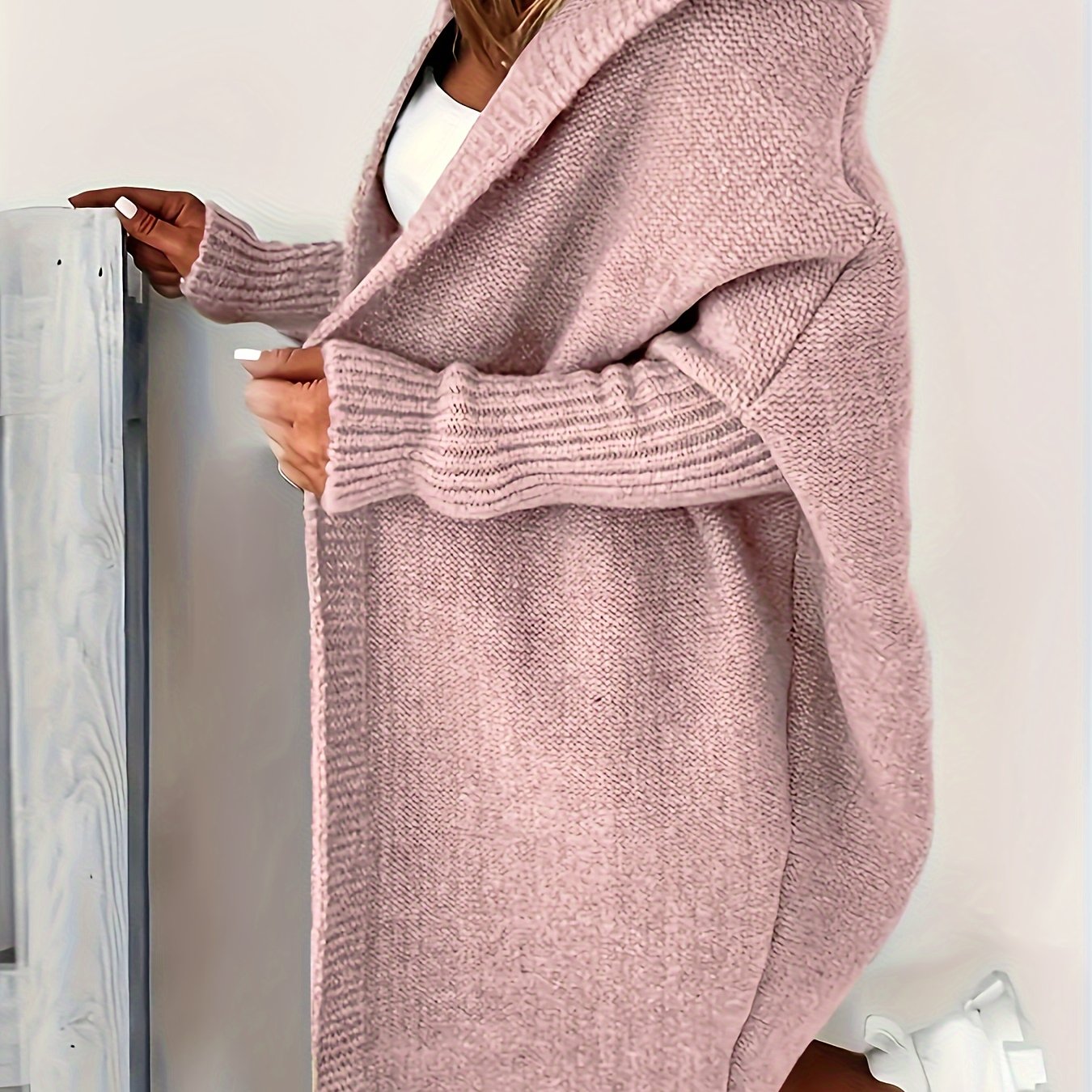 Plus size cozy gray cardigan with batwing sleeves, perfect for spring/fall. Made of easy-care polyester.