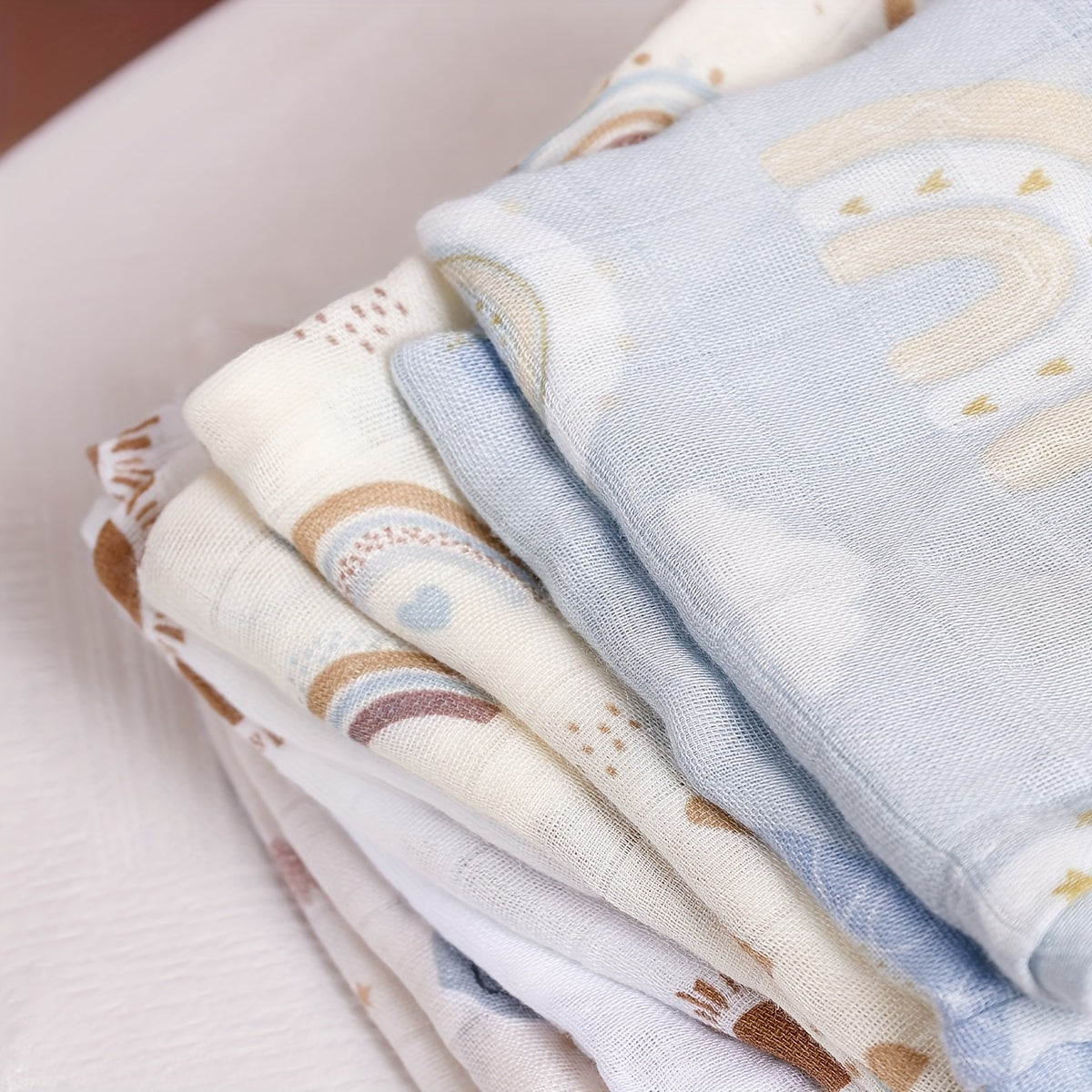 Introducing the versatile Bamboo Muslin Swaddle Feeding Burp Cloths Set, featuring 5 pieces measuring 59.99*59.99cm each. These super soft cloths can be used as face towels, hand towels, and even as bibs, adorned with a colorful rainbow and animal print