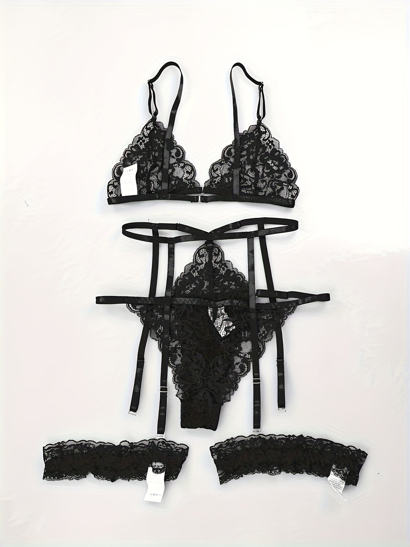 4-piece set of sexy lingerie with lace triangle cup bra, panties, suspender socks, and seduction ring in European and American styles.