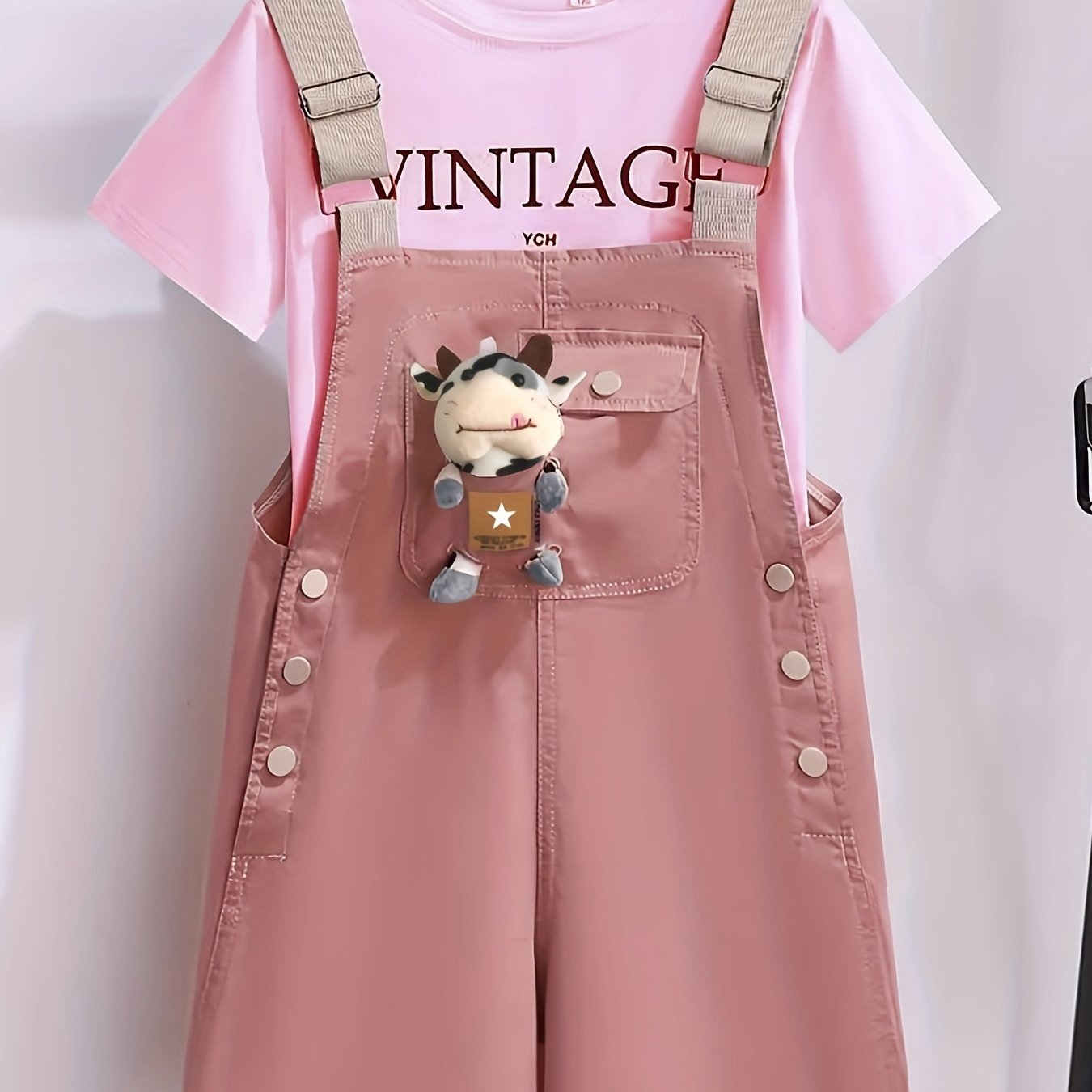 Girls' summer outfit with trendy suspenders and lightweight overalls for outdoor wear.