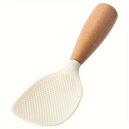 Heat resistant silicone spoon with wooden handle for non-slip rice cooker. Practical kitchen tool for home, school, and dorm.