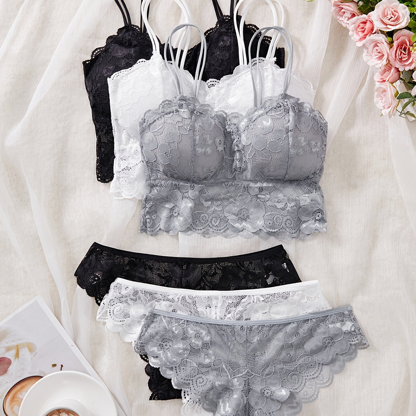 French lace bralette set with removable pads, low support, triangle thong, lace detail, solid color in black, white, or gray. Made of polyamide for adults.