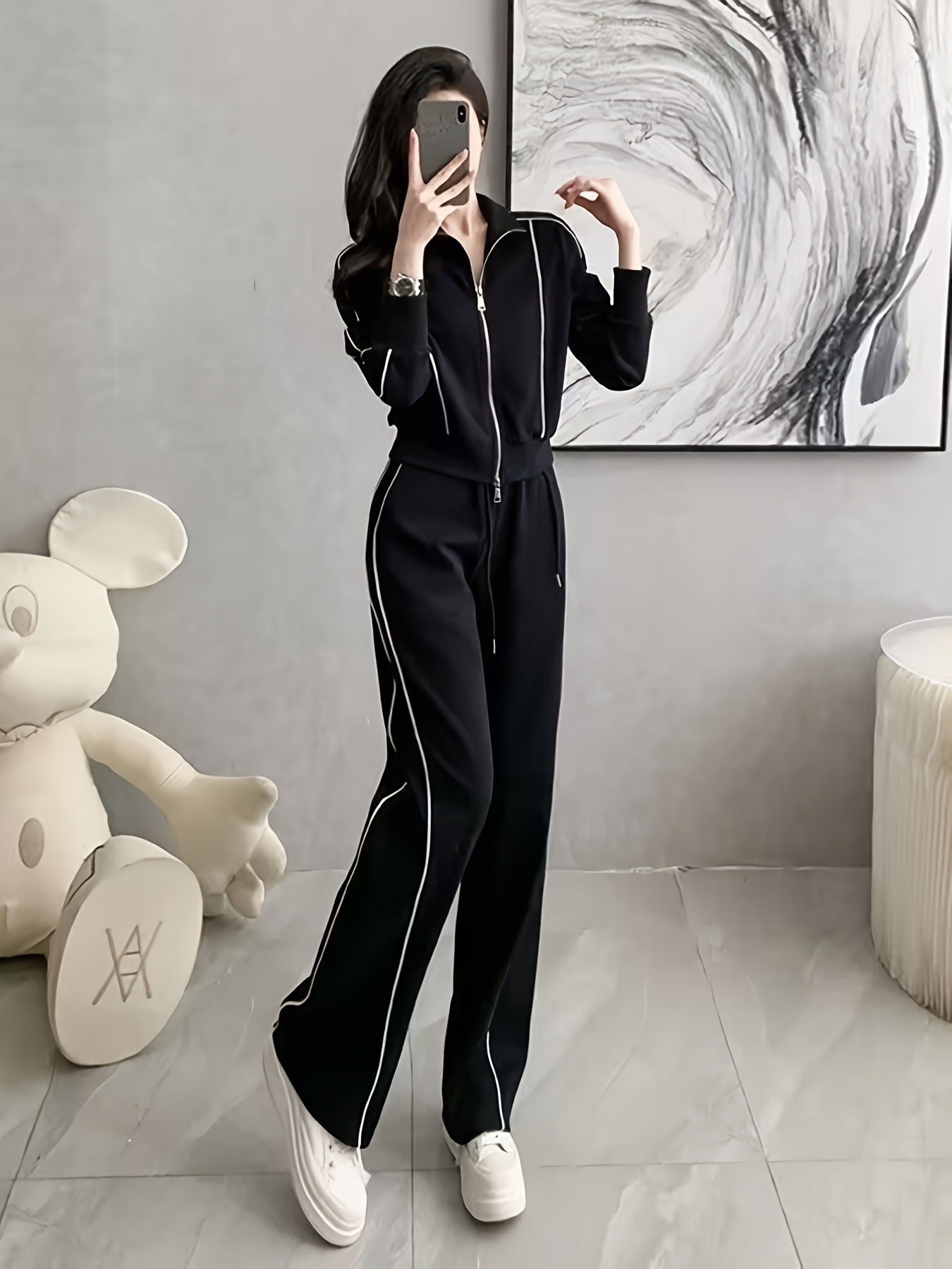 Women's zip-up cardigan and high-waist wide-leg pants set in black, perfect for casual wear. Made from a polyester blend with long sleeves, solid color, and a high-grade European and