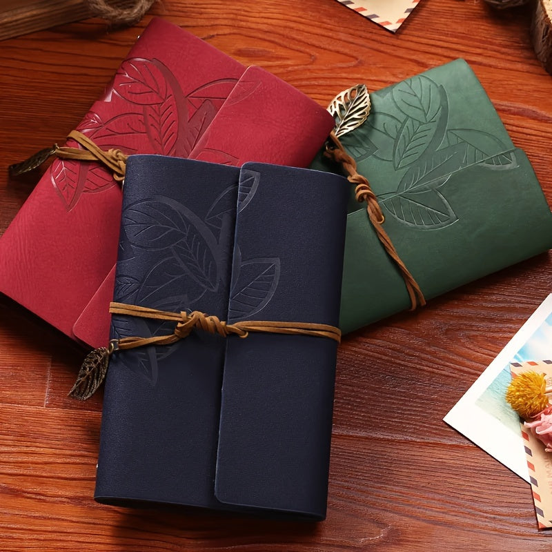 Vintage spiral-bound faux leather notebook with leaf-embossed design and strap closure, available in black, orange, and blue, perfect for students and travelers.